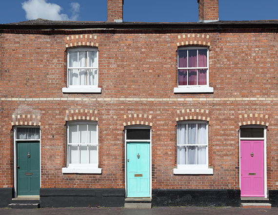 row of terrace houses with colourful doors