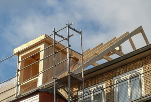 Picture of a home with scaffolding on the roof