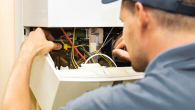 Plumber repairing boiler