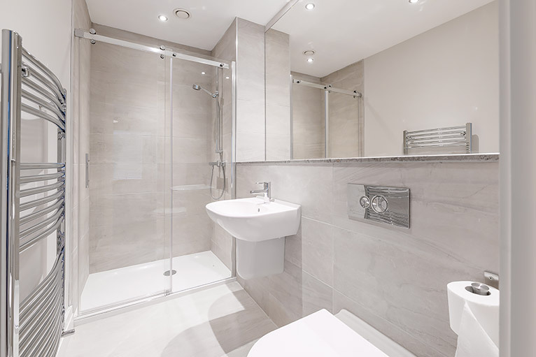 Large and minimal bathroom with white and light grey