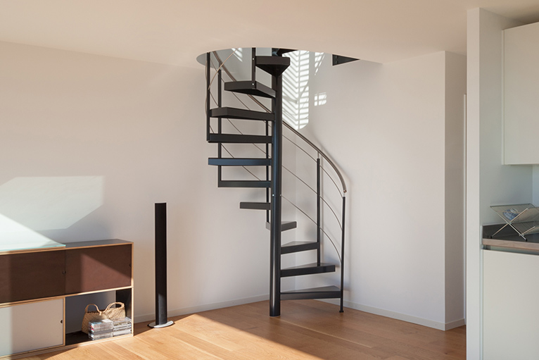 Staircase with metal steps spiralling upwards