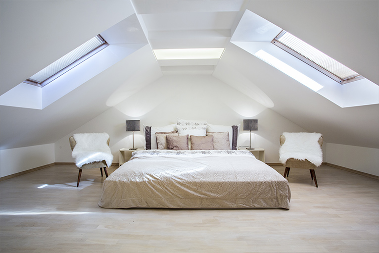 Picture of a bedroom with white walls and furniture