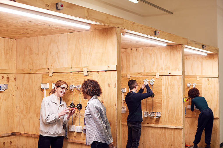 Electrical apprentices learning practical skills at college