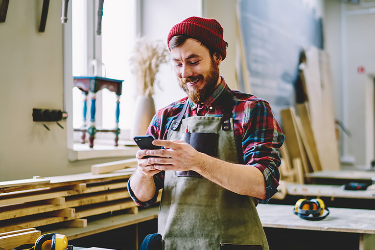 Tradesperson using a smartphone