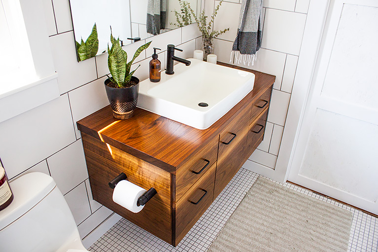 Wall-mounted vanity unit with toilet roll storage