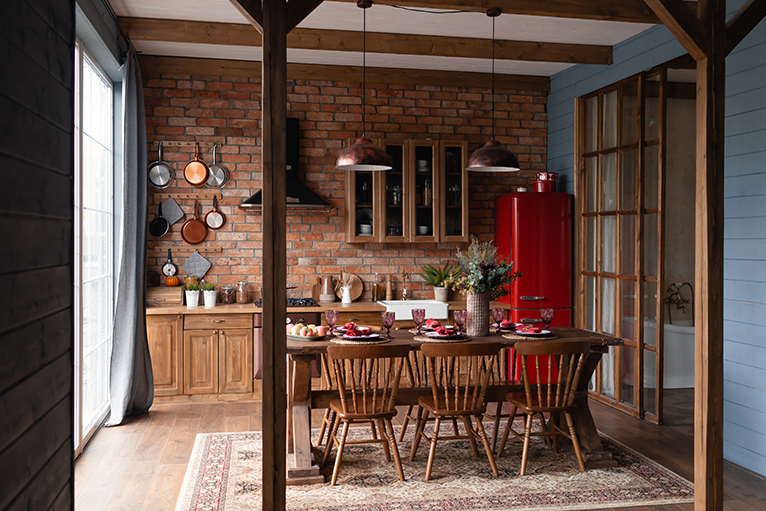 Wood beams, cupboards, dining table and chairs in kitchen