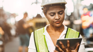 Tradeswoman using tablet