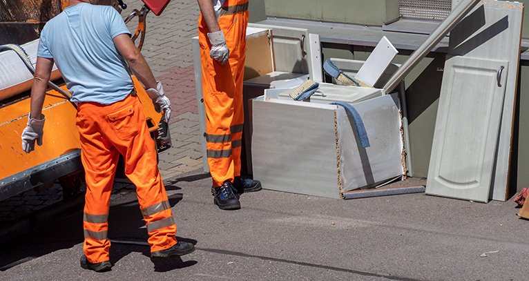 Removal men removing household waste