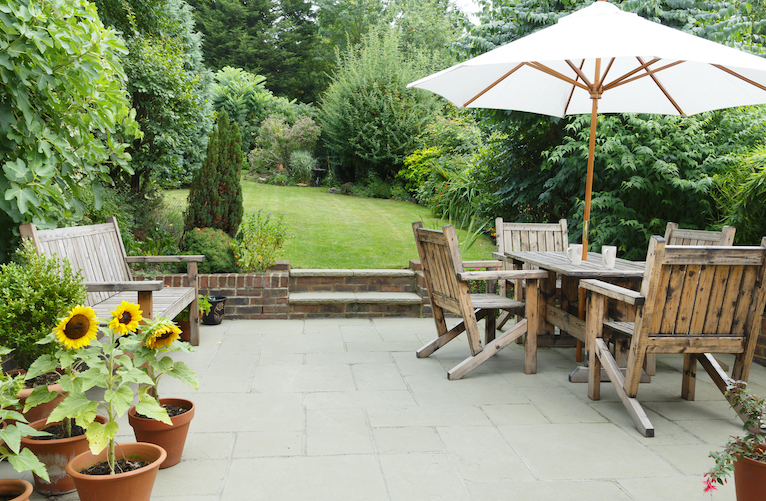 Garden with paved patio and lawn