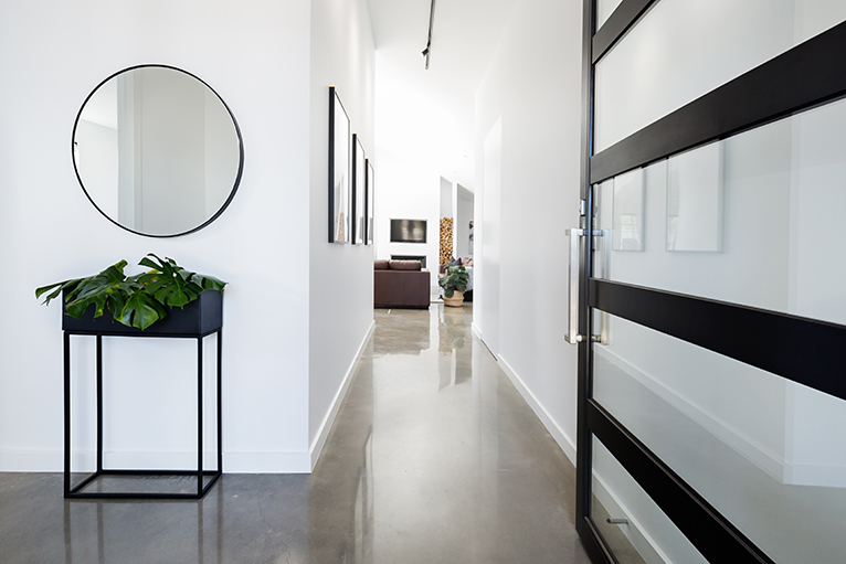 Contemporary hallway with polished concrete floors