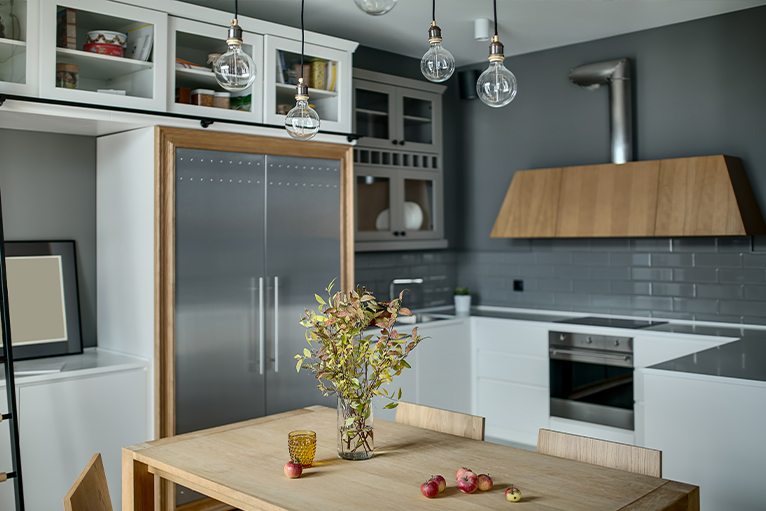 White kitchen with grey tiles