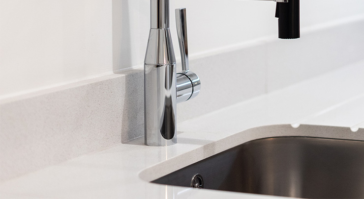 Picture of a kitchen upstaged behind a kitchen sink