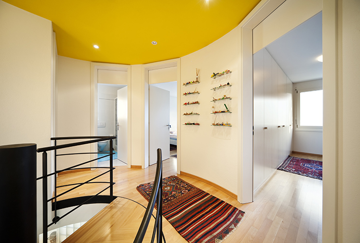 Picture of a hallway with a yellow ceiling