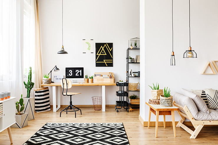 Picture of a living room with geometric art and wooden floors