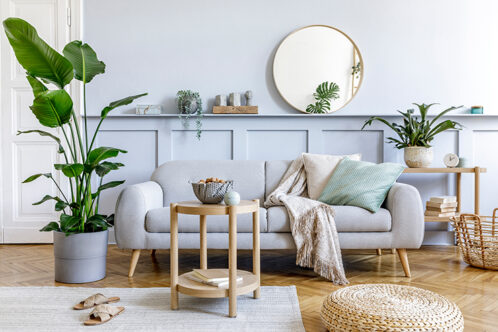 Picture of a small round mirror in a living room