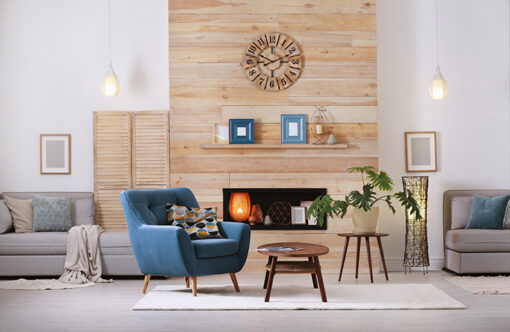 Picture of a living room with wooden panel walls and a blue armchair