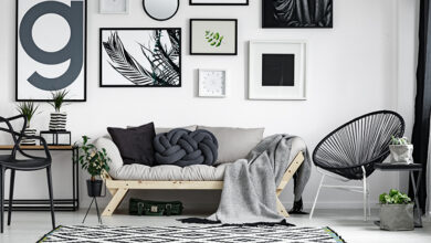 Picture of a living room with several hanging images