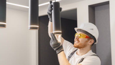 Picture of an electrician installing a hanging light