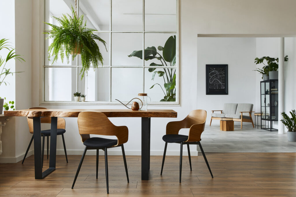 Picture of a living room with plants and table 